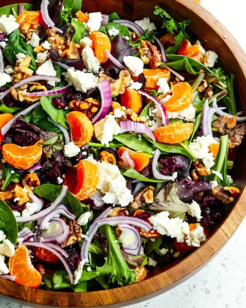 Mandarin orange salad in a wooden salad bowl. 