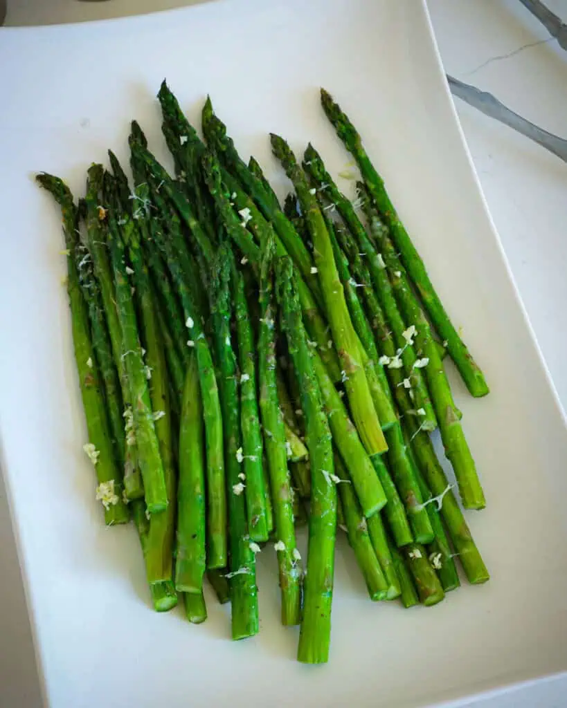 Garlic parmesan roasted asparagus on a plate. 