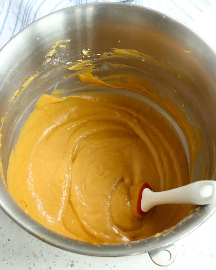 Using an electric mixer or stand mixer with the paddle attachment on medium speed, beat the cream cheese till its texture is smooth and creamy with no lumps. Then, reduce the speed to low and slowly add the pumpkin puree and powdered sugar in several increments, alternating between the two. 