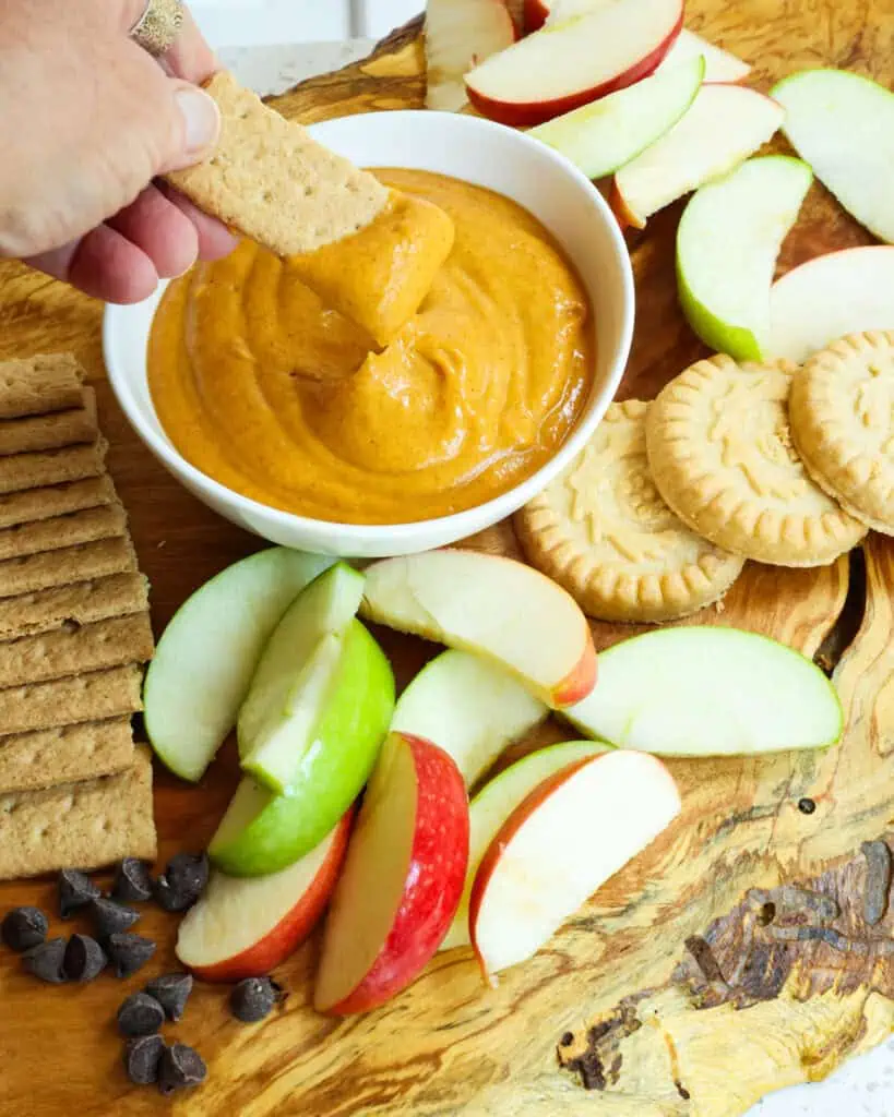 A graham cracker dipped in homemade pumpkin dip. 