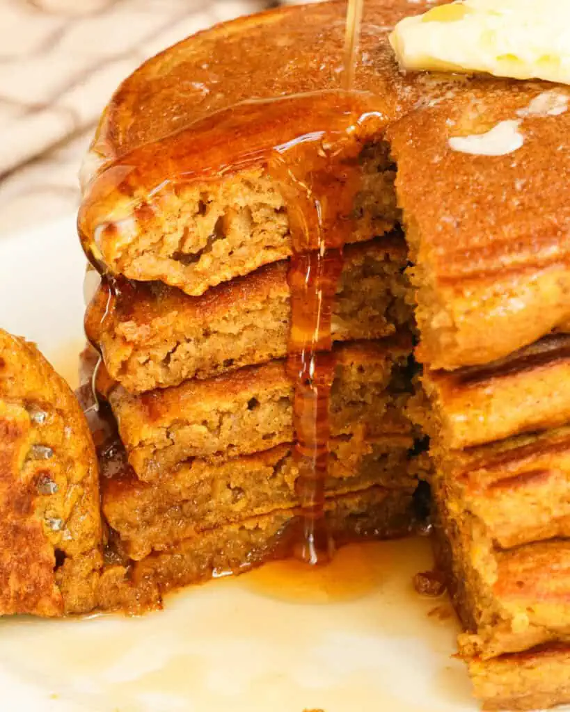 A stack of pumpkins with syrup and butter running down the stack. 