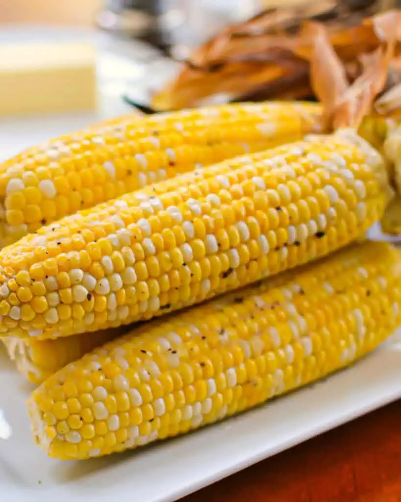 Oven roasted corn on a plate. 