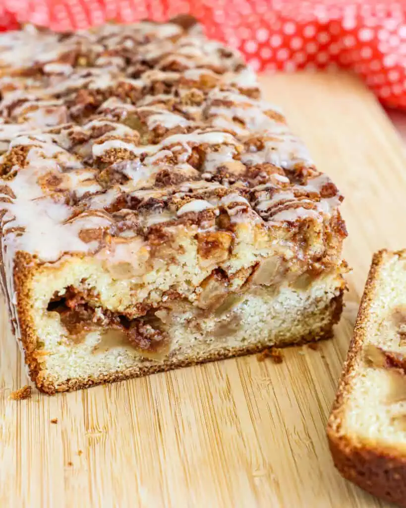 Delicious homemade apple fritter bread with chunks of fresh apples, cinnamon sugar, and vanilla cinnamon glaze. 