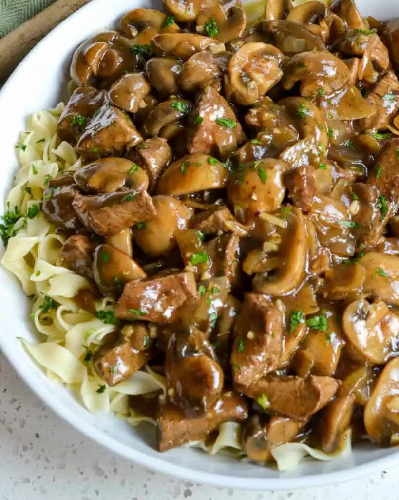 Beef and noodles in a serving bowl. 