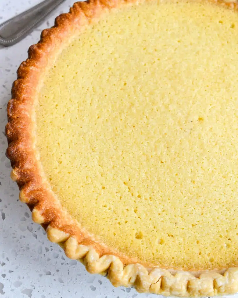 An overhead view of a fresh baked buttermilk pie. 