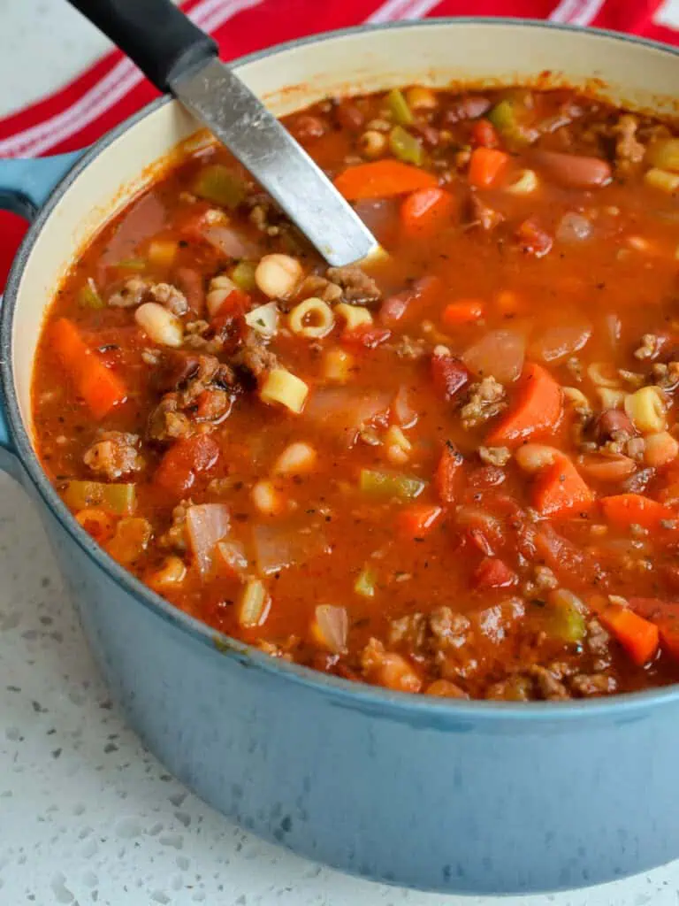 A Dutch oven full of pasta e fagioli. 