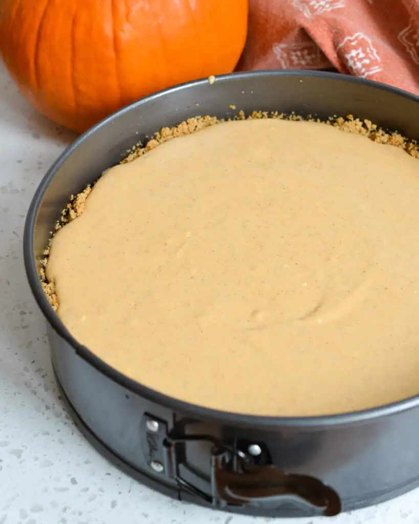 A prepped pumpkin cheesecake, ready to go into the oven. 