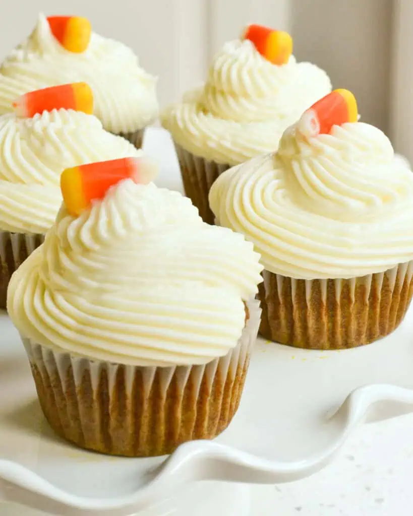 Close up view of multiple cupcakes on a cake stand. 