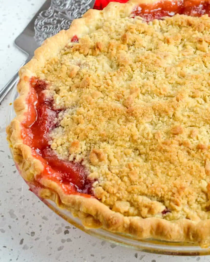 Overhead view of a freshly baked strawberry rhubarb pie. 
