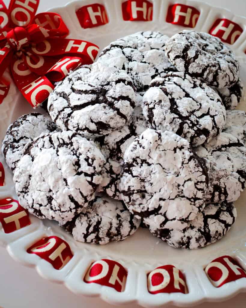 Chocolate crinkle cookies on a Christmas platter. 