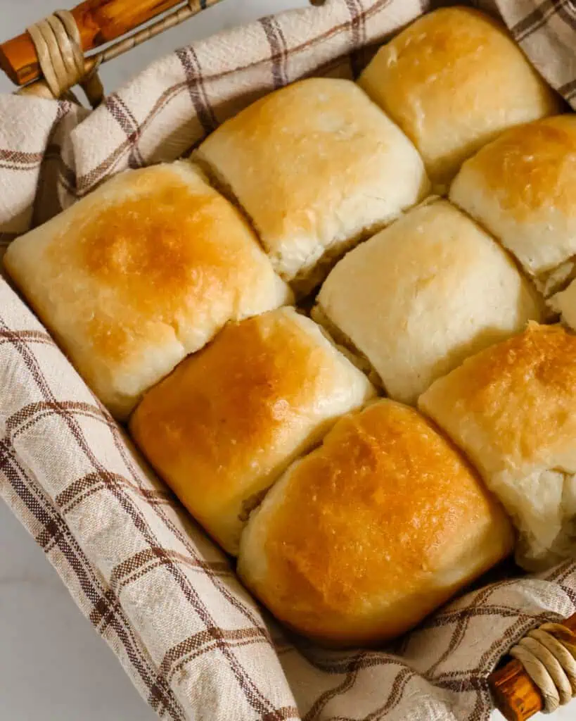 Homemade yesst rolls in a bread basket. 