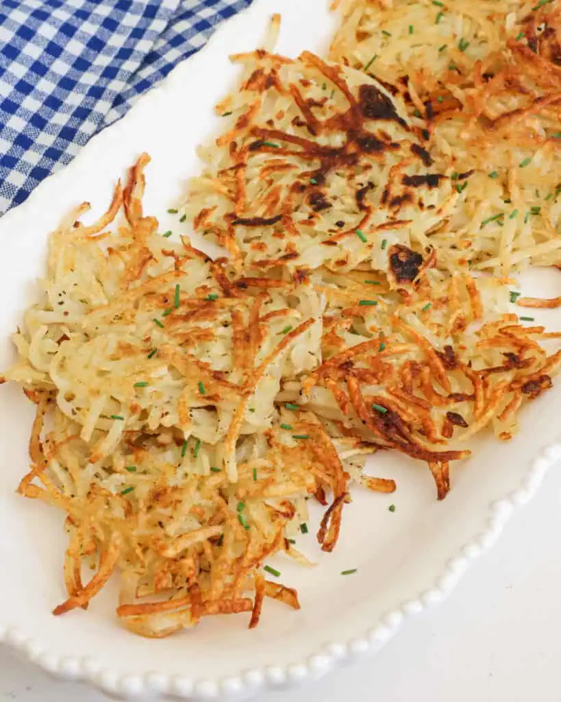 Crispy potato pancakes on a serving platter