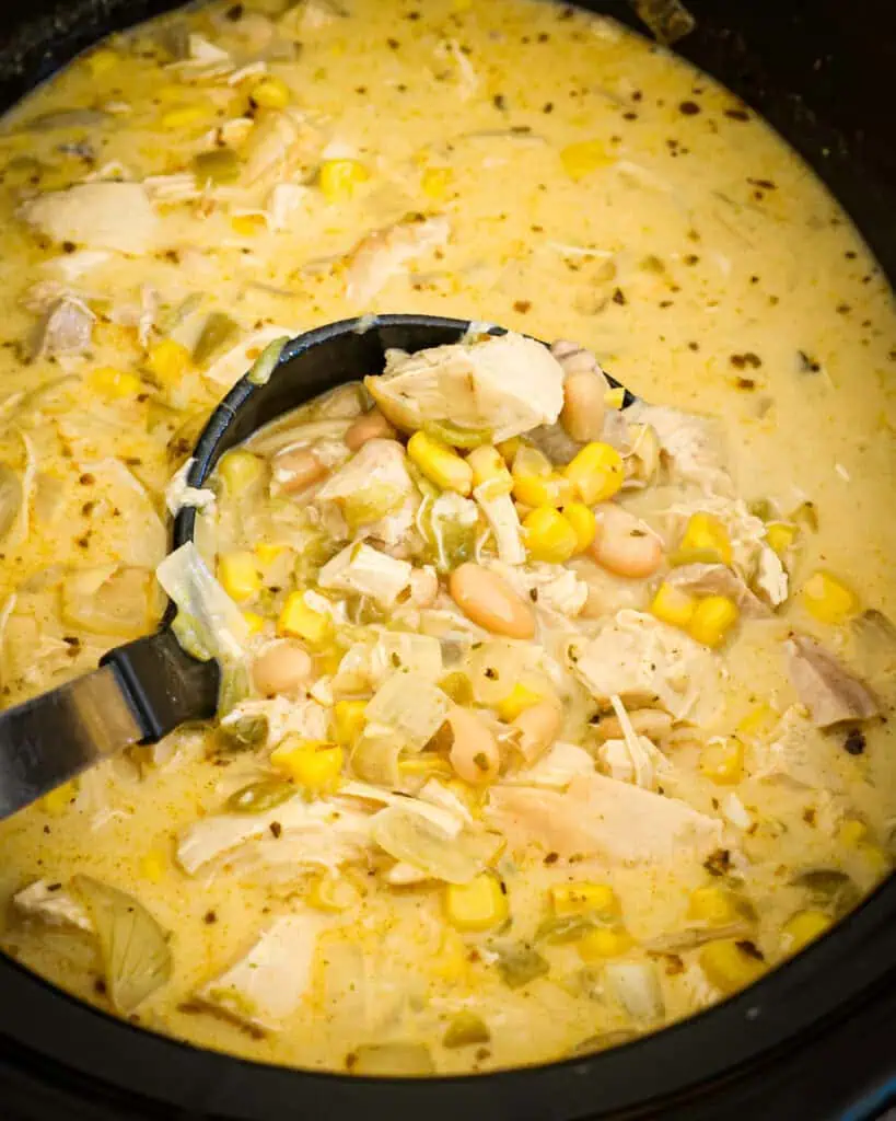 A crockpot full of white chicken chili. 