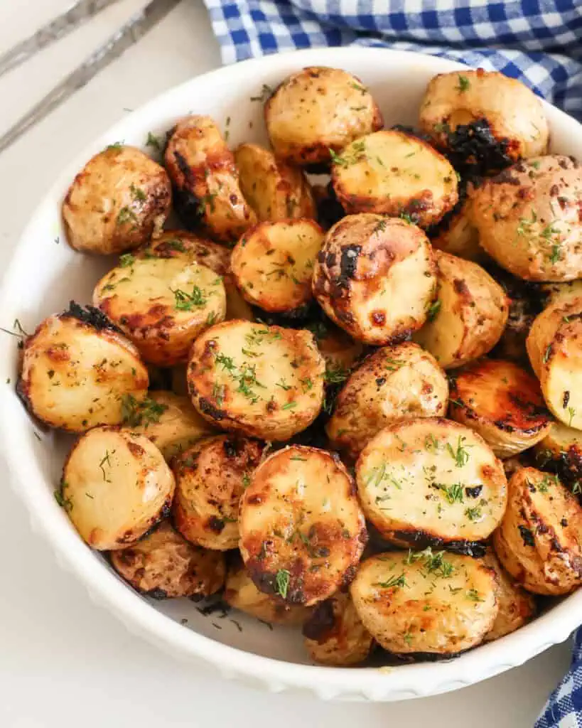 A serving bowl full of crispy ranch potatoes. 