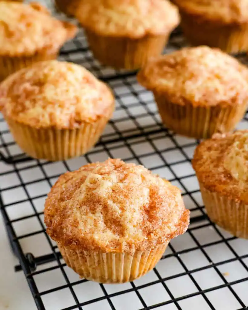 Cinnamon muffins on a cooling rack. 