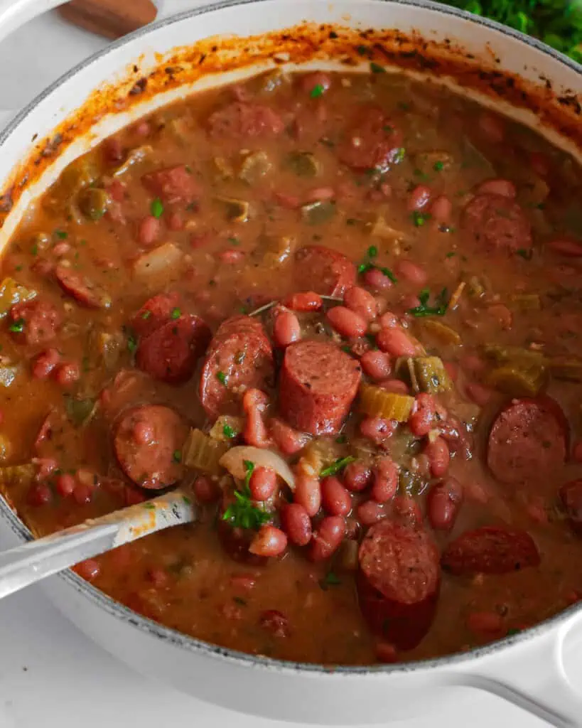 A large Dutch oven full of red beans and rice. 