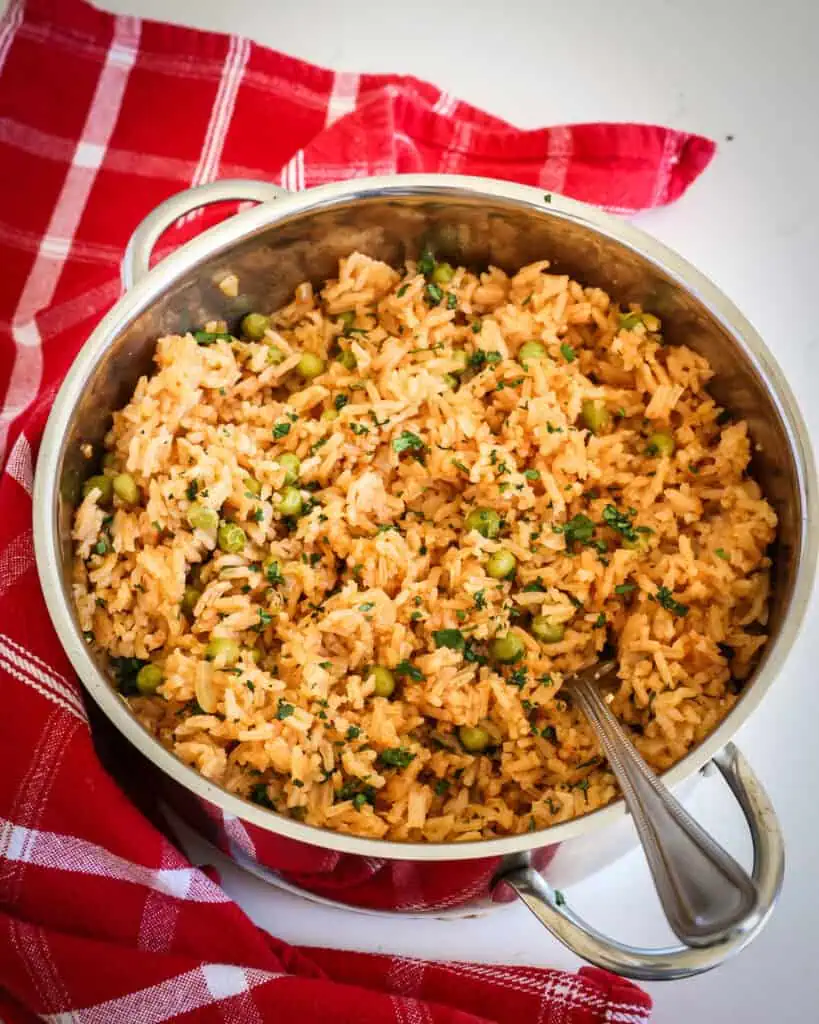 An overhead view of a pot full of Mexican rice. 